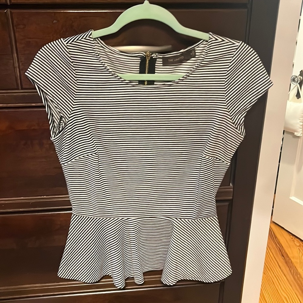 Black and white peplum top. Size S. Nicely fitted style. Looks great on